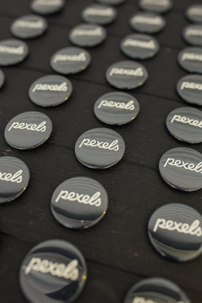 Rows of Pexels badges neatly arranged on a dark surface.